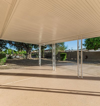 Shaded patio area ideal for relaxing or entertaining outdoors. This Sun City home features low-maintenance yard space and outdoor comfort.