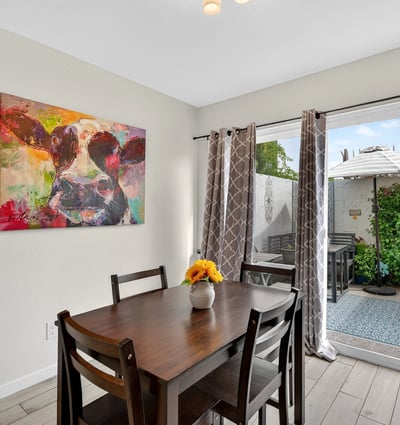 Inviting Scottsdale dining area with sliding glass door to private patio, blending indoor comfort with outdoor living and natural light.