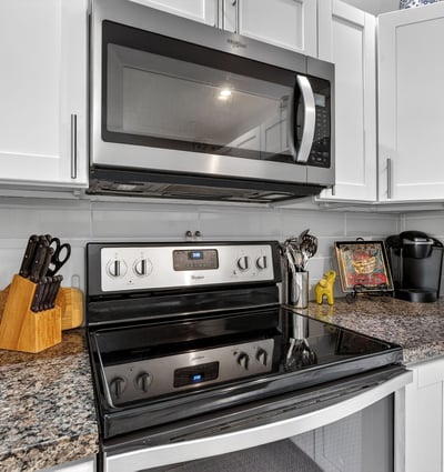 Stylish Scottsdale kitchen showcasing granite counters, stainless appliances, modern cabinetry, and efficient layout ideal for everyday living.