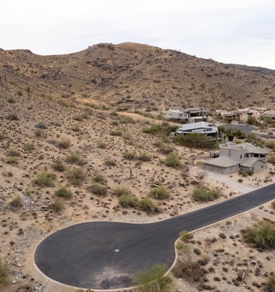 Exceptional hillside lot bordering protected preserve land, offering privacy, scenic desert terrain, and direct access to hiking and biking trails. A rare opportunity to build surrounded by untouched natural beauty.