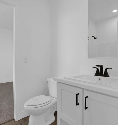 Stylish Jack-and-Jill bathroom with modern finishes, sleek fixtures, and practical access between adjoining bedrooms. An ideal setup for family living while maintaining privacy and convenience.