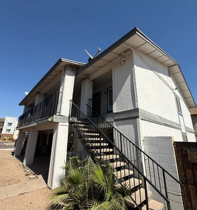 Exterior view of the apartment community featuring covered balconies, upper-level access, and low-maintenance desert landscaping. This Glendale property offers convenience, accessibility, and proximity to popular shopping and entertainment destinations.