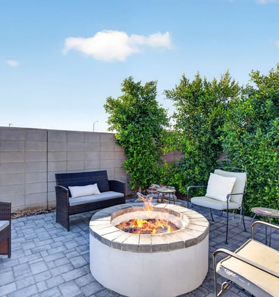 Relax with family and friends around the custom fire pit surrounded by attractive pavers, mature landscaping, and a private hot tub. This outdoor retreat is perfect for enjoying beautiful Arizona evenings.