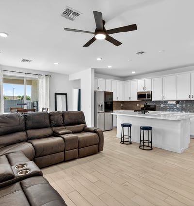 Designed for everyday comfort, the spacious great room features durable wood-look flooring, recessed lighting, ceiling fan, and an open connection to the kitchen for easy entertaining.
