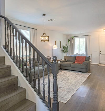 Gorgeous kitchen with quartz countertops, stainless steel appliances, expansive island seating, and an open-concept design perfect for entertaining and everyday family life.