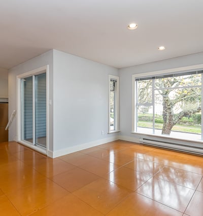 Bright, open living space featuring large windows and easy access to outdoor views and natural light.