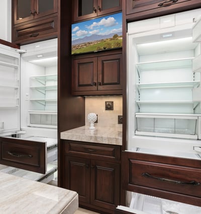 This gourmet kitchen features dual Sub Zero refrigerators, 4 pull out freezer drawers with ample storage, fun appliance garage and modern finishes for culinary enthusiasts.