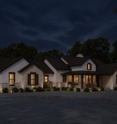 Modern home featuring unique architectural details, expansive outdoor space, and inviting nighttime ambiance in a quiet neighborhood.