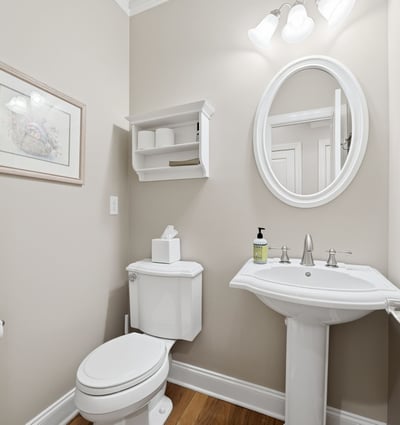Bright and functional half bath featuring modern fixtures and a clean, inviting atmosphere.