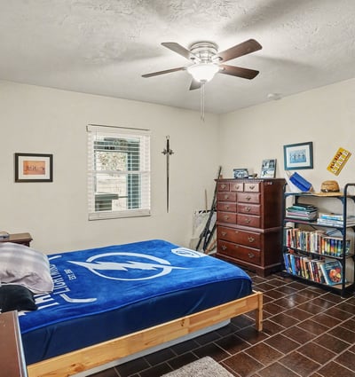 Another view of the first bedroom from the door located off of the hallway across from the bathroom.