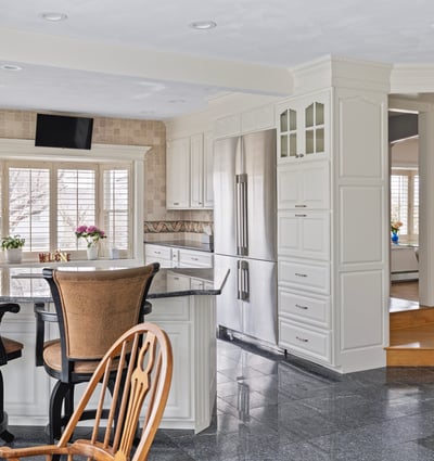 Bright, spacious kitchen features modern appliances, ample counter space, and a cozy dining area for gatherings.