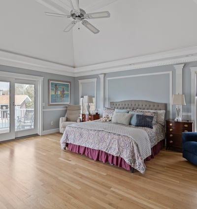 Spacious master bedroom with vaulted ceiling, private balcony access, and ample natural light. Perfect for relaxation.