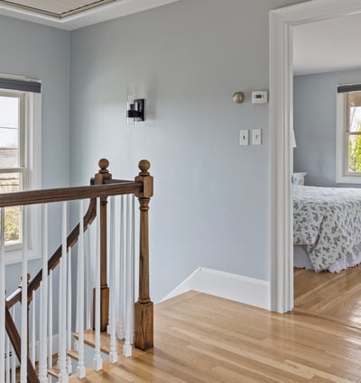 Bright and inviting, this well-lit landing leads to a cozy bedroom with lovely views.