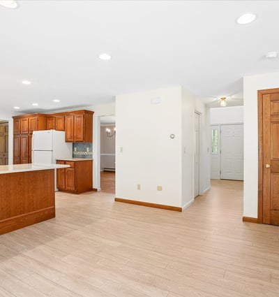 Spacious open-concept kitchen and living area with ample natural light and modern finishes throughout.