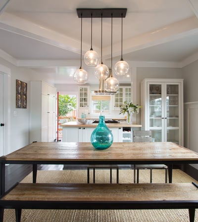 Open and spacious living and dining area. Original craftsman ceilings.