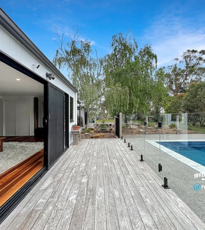 Modern home featuring open spaces, seamless indoor-outdoor flow, and a refreshing pool set amidst nature.
