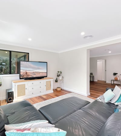 Bright and spacious living area featuring modern furnishings and large windows for natural light.