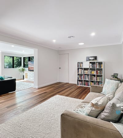 Spacious living area with modern finishes, large windows, and an inviting atmosphere perfect for relaxation.