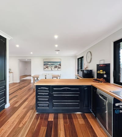 Modern kitchen featuring rich wood accents, ample counter space, and an open layout perfect for entertaining.