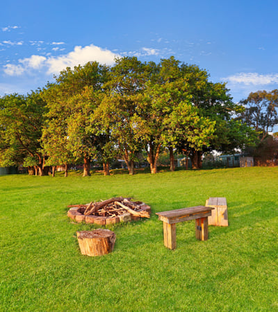 Expansive outdoor space featuring a cozy fire pit area, perfect for gatherings and relaxation.