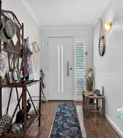 Bright entryway featuring unique decor and ample natural light, perfect for welcoming guests into your home.