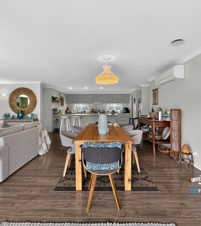 Spacious open-plan living and dining area, seamlessly connecting to a modern kitchen for effortless entertaining.