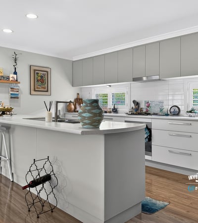 Modern kitchen featuring ample storage, sleek cabinetry, and a functional island, perfect for culinary enthusiasts.