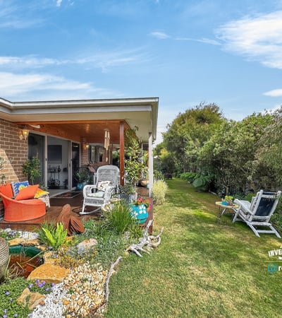 Bright outdoor space featuring lush gardens, inviting seating areas, and a peaceful atmosphere for relaxation.