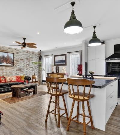 Bright and inviting open-concept living space featuring modern amenities and a cozy atmosphere.