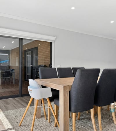 Bright dining area seamlessly connects to an outdoor space, perfect for entertaining family and friends.