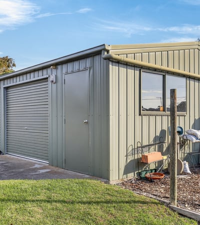 Versatile shed with ample storage space, perfect for workshops, hobbies, or vehicle parking in a convenient location.