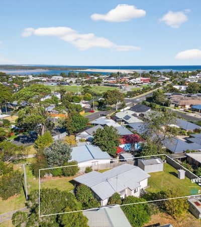 Scenic coastal property with panoramic views, offering potential for development in a vibrant neighborhood.
