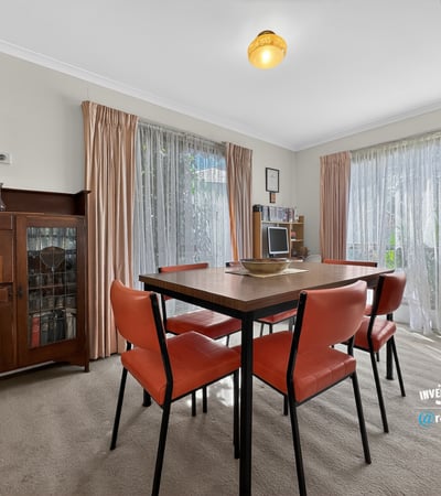 Bright and inviting dining area with ample natural light and a warm, welcoming atmosphere.