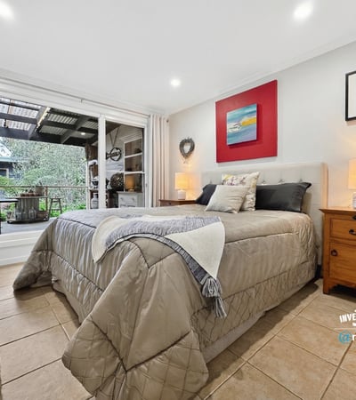Bright and inviting bedroom featuring direct access to a private outdoor terrace for relaxed living.