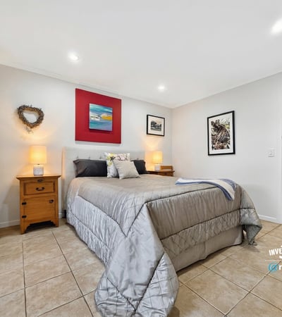 Spacious bedroom featuring modern decor, natural light, and ample storage for a comfortable living experience.