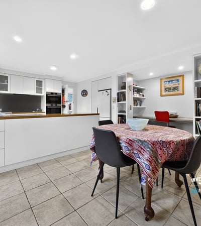 Bright and functional kitchen featuring modern appliances, ample storage, and a cozy dining area.