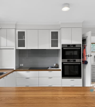 Modern kitchen with sleek cabinetry, high-quality appliances, and ample natural light creating an inviting atmosphere.