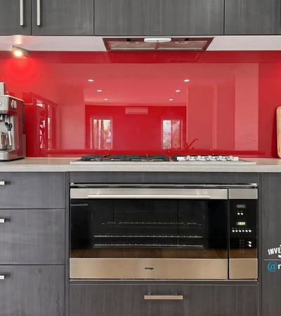Modern kitchen featuring sleek cabinetry, a vibrant backsplash, and high-end appliances for culinary enthusiasts.