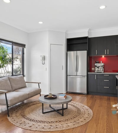 Modern kitchen and inviting living area with natural light, perfect for comfortable daily living.
