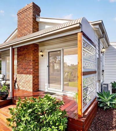 Inviting home features a spacious deck and lush landscaping, perfect for outdoor gatherings and relaxation.