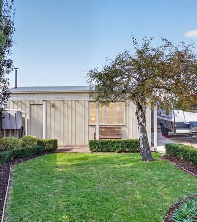 This modern property features a landscaped garden and inviting outdoor space perfect for relaxation and entertainment.