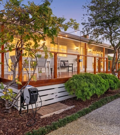 Discover this inviting home featuring a spacious deck, landscaped gardens, and modern amenities throughout.