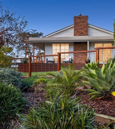 Discover a stunning home with expansive outdoor spaces and picturesque landscaping, perfect for relaxing or entertaining.