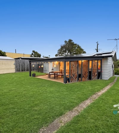 Discover this unique property featuring a spacious yard and modern outdoor living space, perfect for entertaining.