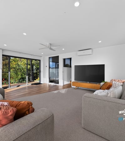 Bright and spacious living area with large windows, offering panoramic views and seamless indoor-outdoor flow.