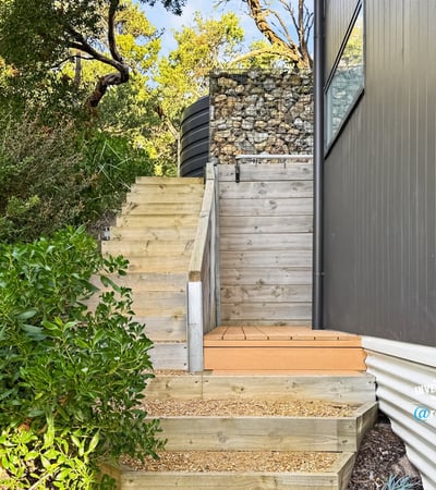 Discover this unique outdoor entrance featuring modern design elements and natural landscaping for easy accessibility.