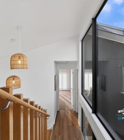Modern open-concept design featuring natural light and unique pendant lighting, ideal for contemporary living.