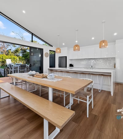Bright and spacious kitchen features modern amenities, abundant natural light, and an inviting dining area.