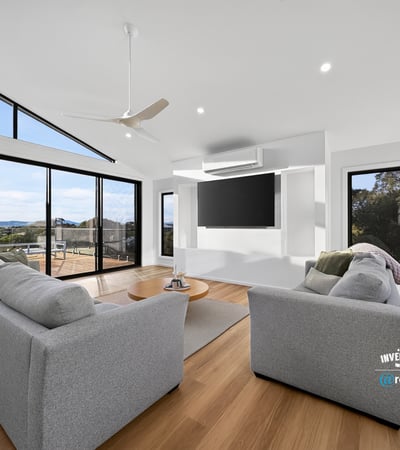 Bright and airy living space featuring large windows that showcase stunning outdoor views and modern design.