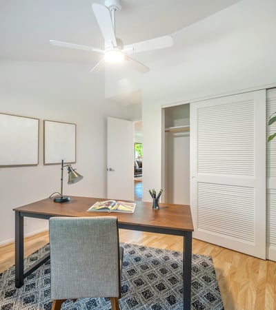 Bright and inviting workspace featuring modern finishes, ample natural light, and a spacious closet.